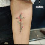 cross flower girl tattoo