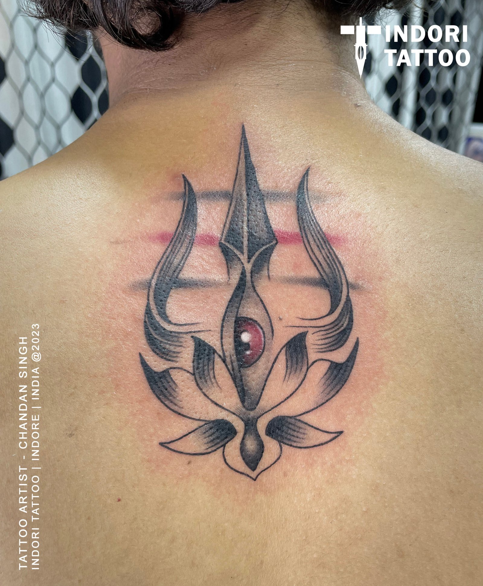 trishul wiht eye and lotus tattoo